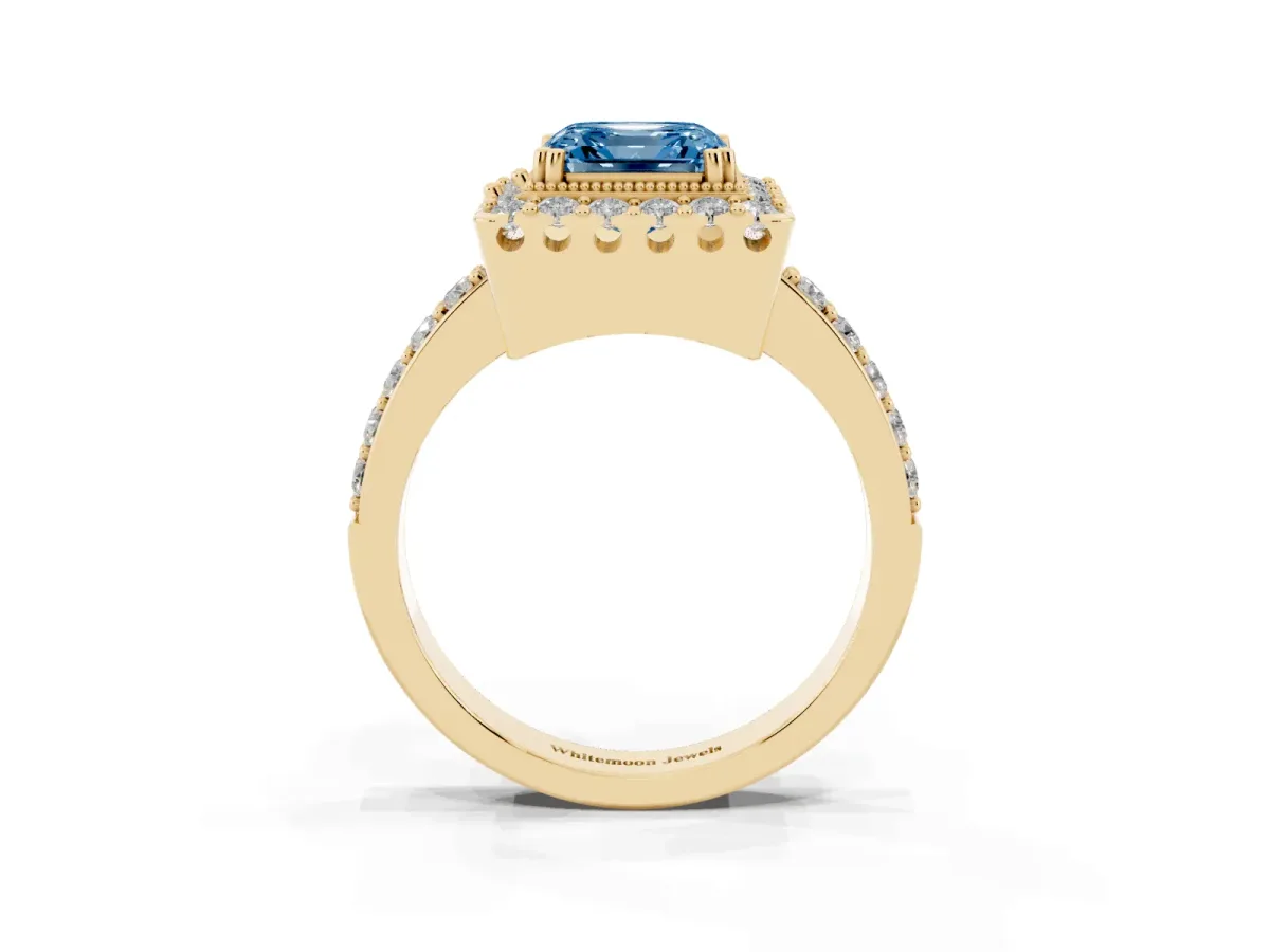 Fancy Blue Asscher Cut Diamond Halo Ring with Pavé Band and Prong Setting Yellow gold