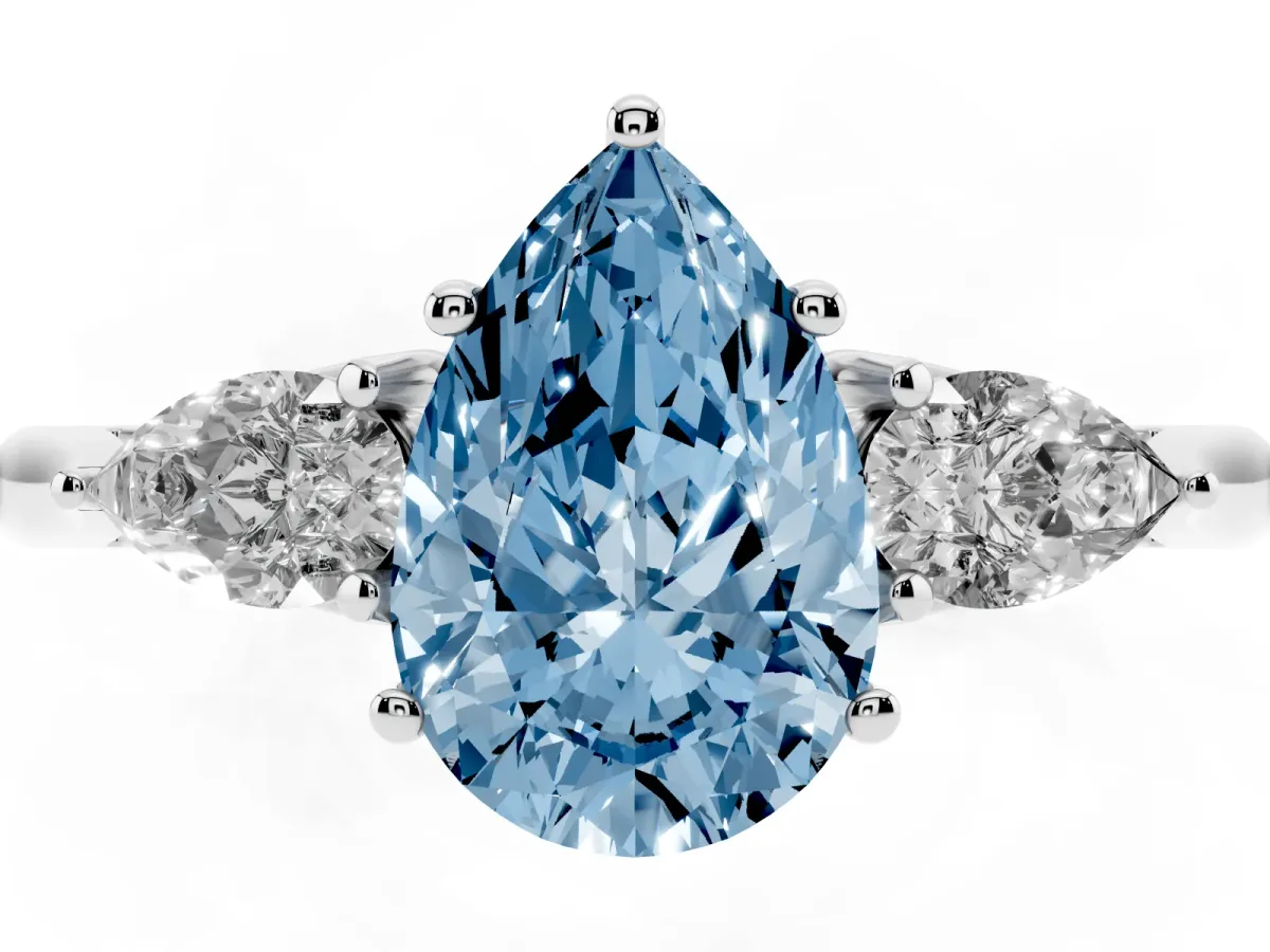 Fancy Blue Three-Stone Pear Cut Diamond Ring with Pear Side Stones in Four-Prong Setting Platinum