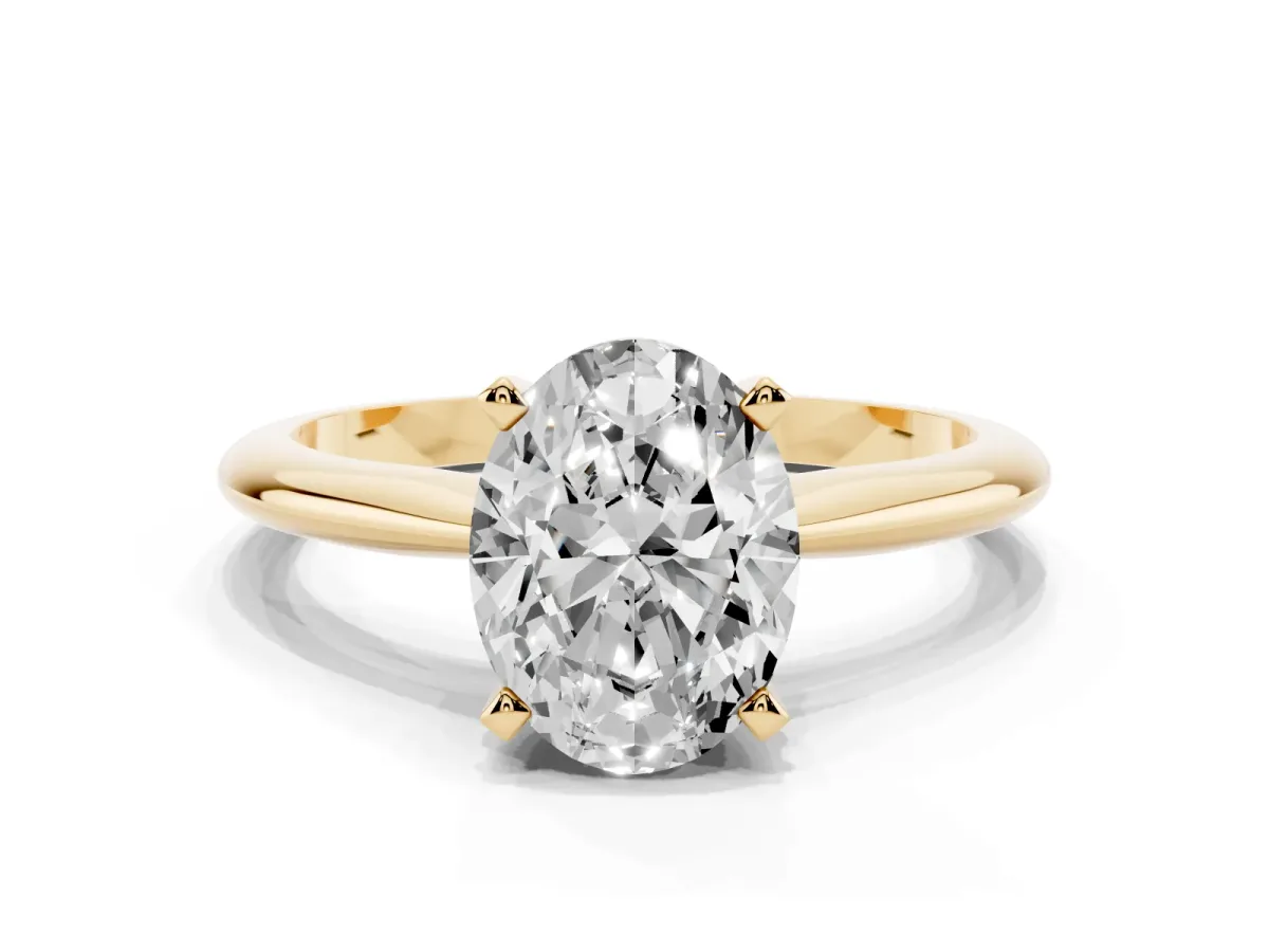 Oval Cut Cut Solitaire Ring with Four-Prong Setting on a Classic Band Yellow gold