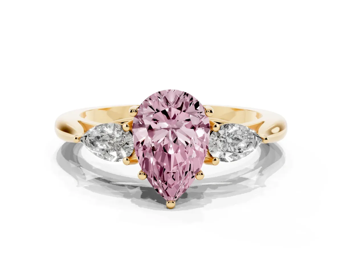 Fancy Pink Three-Stone Pear Cut Diamond Ring with Pear Side Stones in Four-Prong Setting Yellow gold