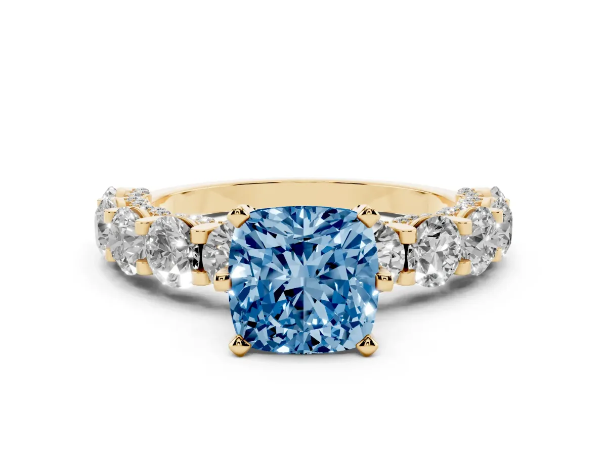 Fancy Blue Cushion Cut Diamond Side Stone Engagement Ring with Four-Prong Setting Yellow gold
