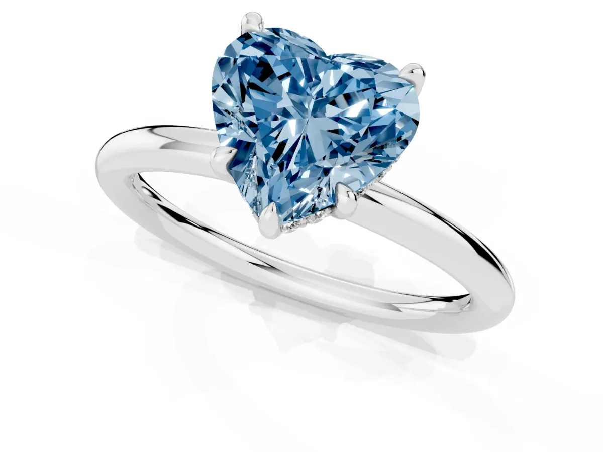 Fancy Blue Heart Cut Diamond Solitaire Ring with Thin Band and Four-Prong Setting Silver