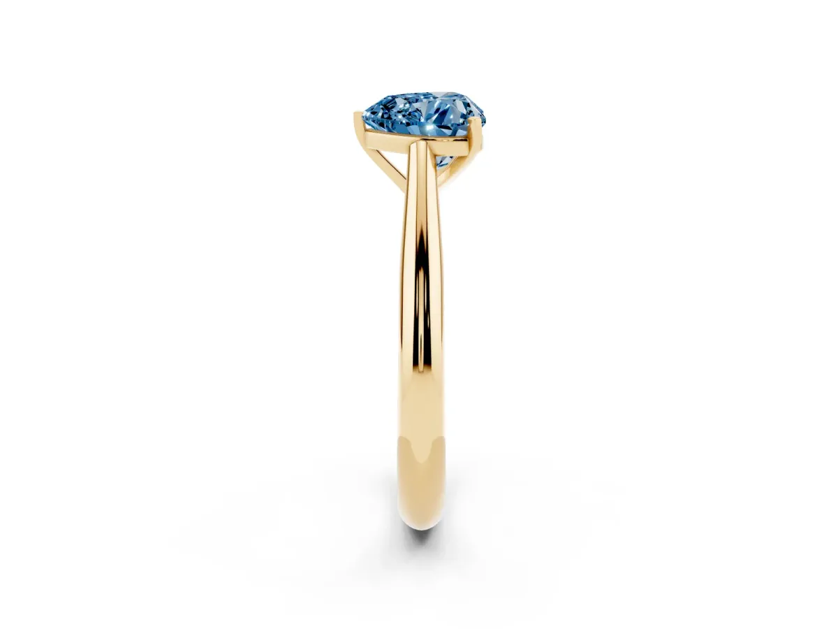Fancy Blue Heart Cut Diamond Solitaire Engagement Ring with Cathedral Setting and Four-Prong Mount Yellow gold