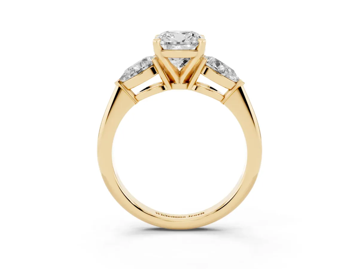 Three-Stone Cushion Cut Diamond Ring with Pear Side Stones and Four-Prong Setting Yellow gold