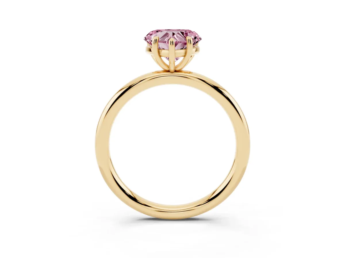 Fancy Pink Heart Cut Solitaire Diamond Ring with Four-Prong Setting on a Plain Band Yellow gold