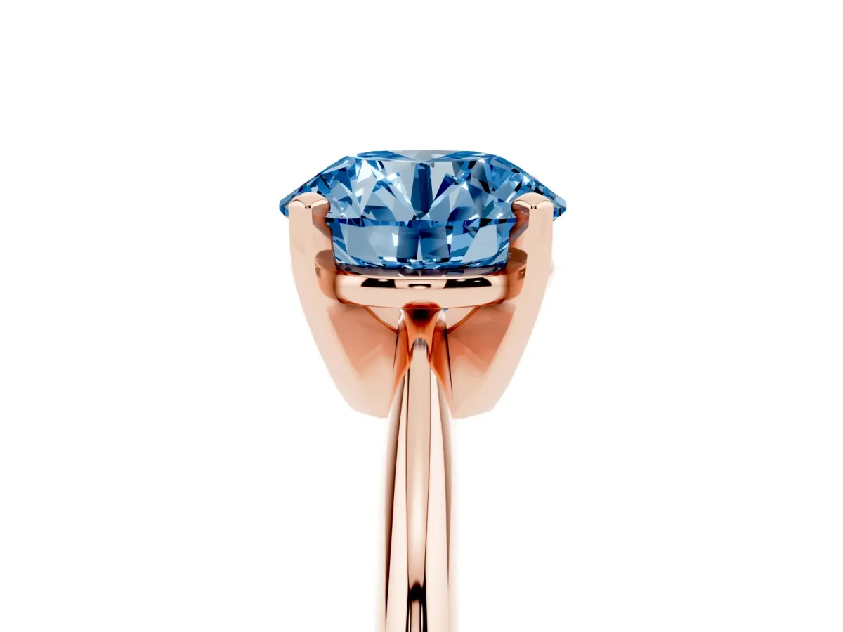 Fancy Blue Round Cut Cut Solitaire Ring with Four-Prong Setting on a Classic Band Rose gold