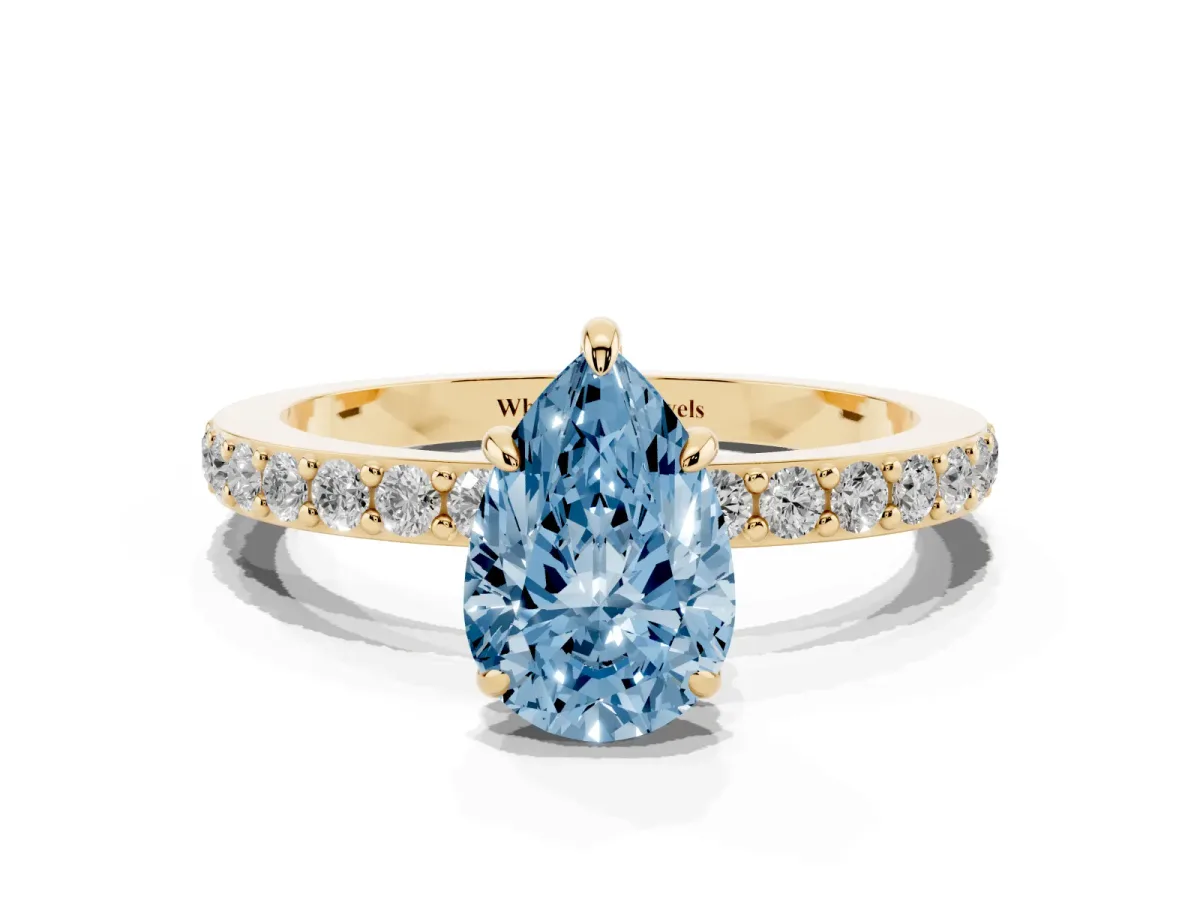Fancy Blue Pear Cut Diamond Pavé Engagement Ring with Round Accents and Prong Setting Yellow gold