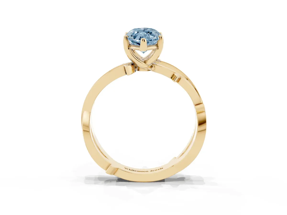 Fancy Blue Marquise Cut Solitaire Twist Band with Pavé Accents and Four-Prong Setting Yellow gold