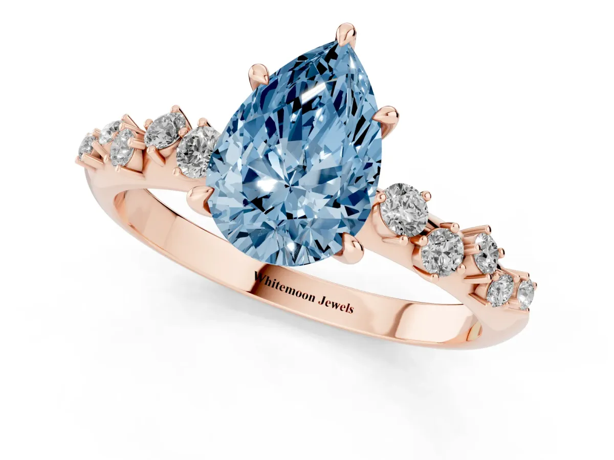 Fancy Blue Pear Cut Diamond Cluster Side Stone Solitaire Ring with Prong Setting Rose gold