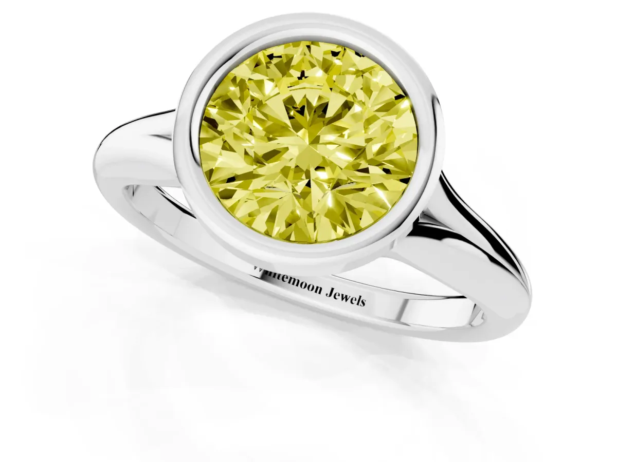 Fancy Yellow Bezel Set Round Cut Solitaire Diamond Ring with Smooth Band Platinum