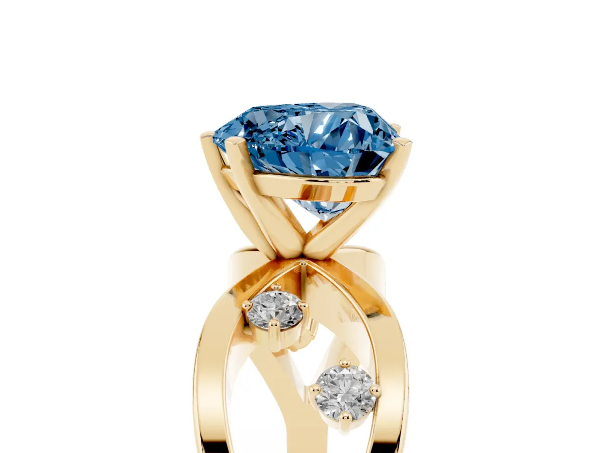 Fancy Blue Heart Cut Cut Solitaire Diamond with Side Stones on Criss-Cross Band and Four-Prong Setting Yellow gold