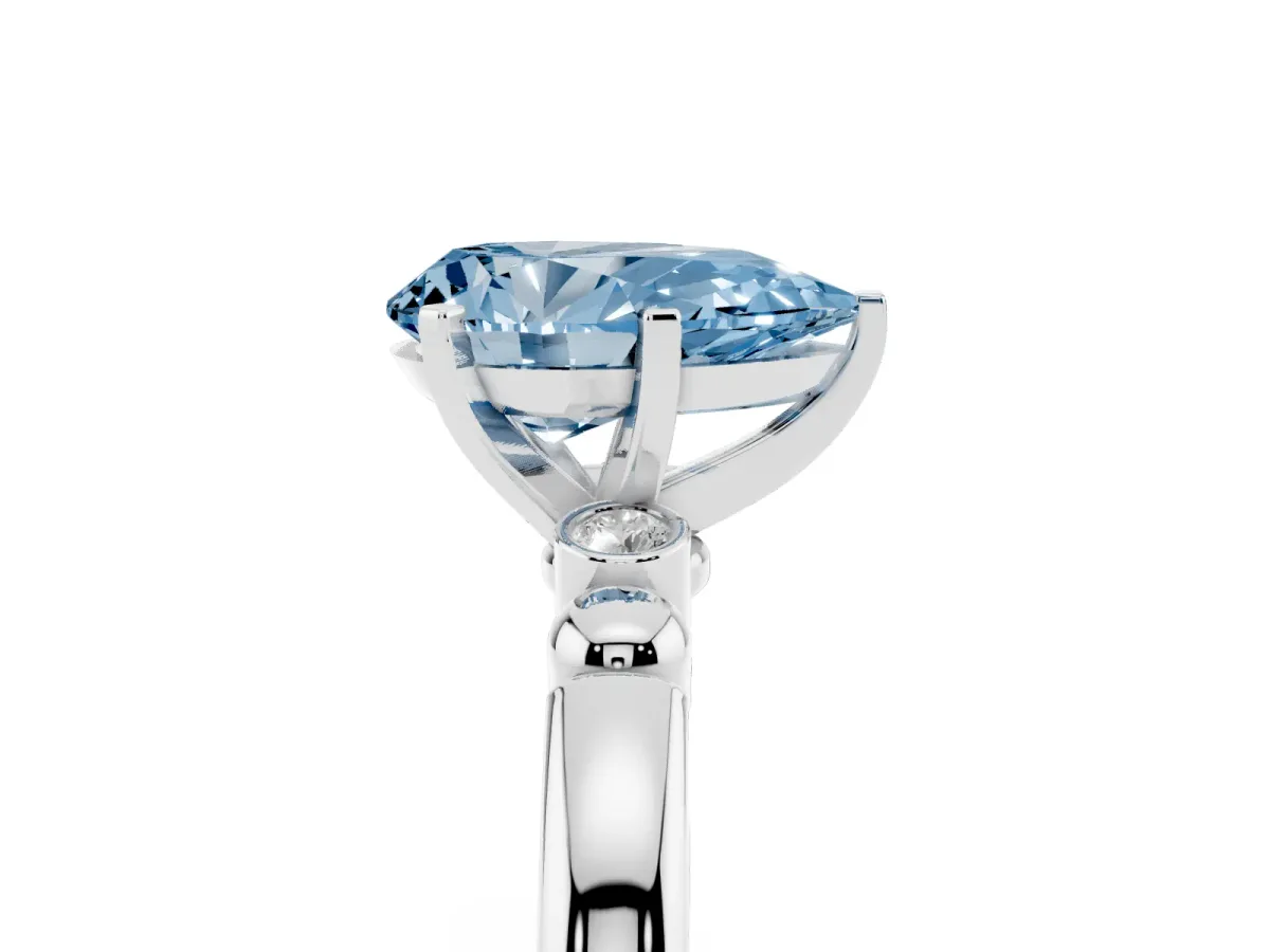 Fancy Blue Pear Cut Solitaire Beaded Band with Four-Prong Setting Silver