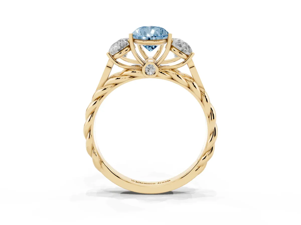 Fancy Blue Three-Stone Pear Cut Diamond Braided Band Ring with Four-Prong Setting Yellow gold