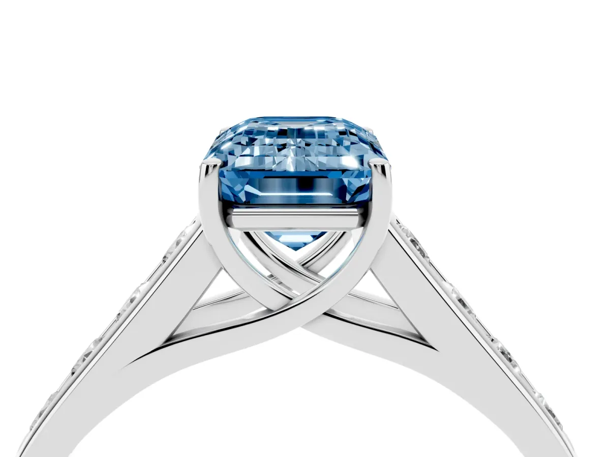 Fancy Blue Emerald Cut Brilliant Channel-Set Solitaire Ring with Four-Prong Setting Platinum