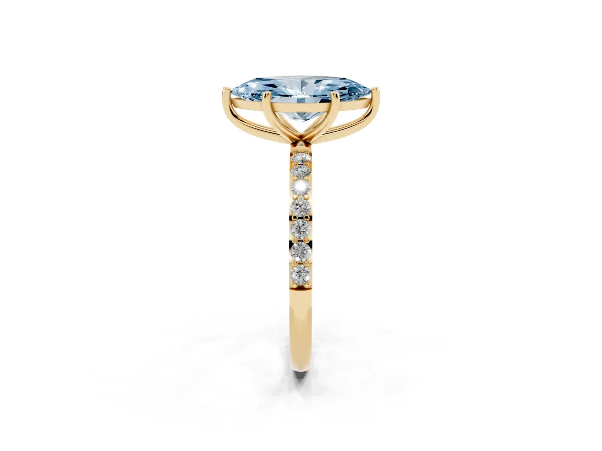 Fancy Blue Marquise Cut Diamond Solitaire Ring with Round Pavé Shoulders and Prong Setting Yellow gold