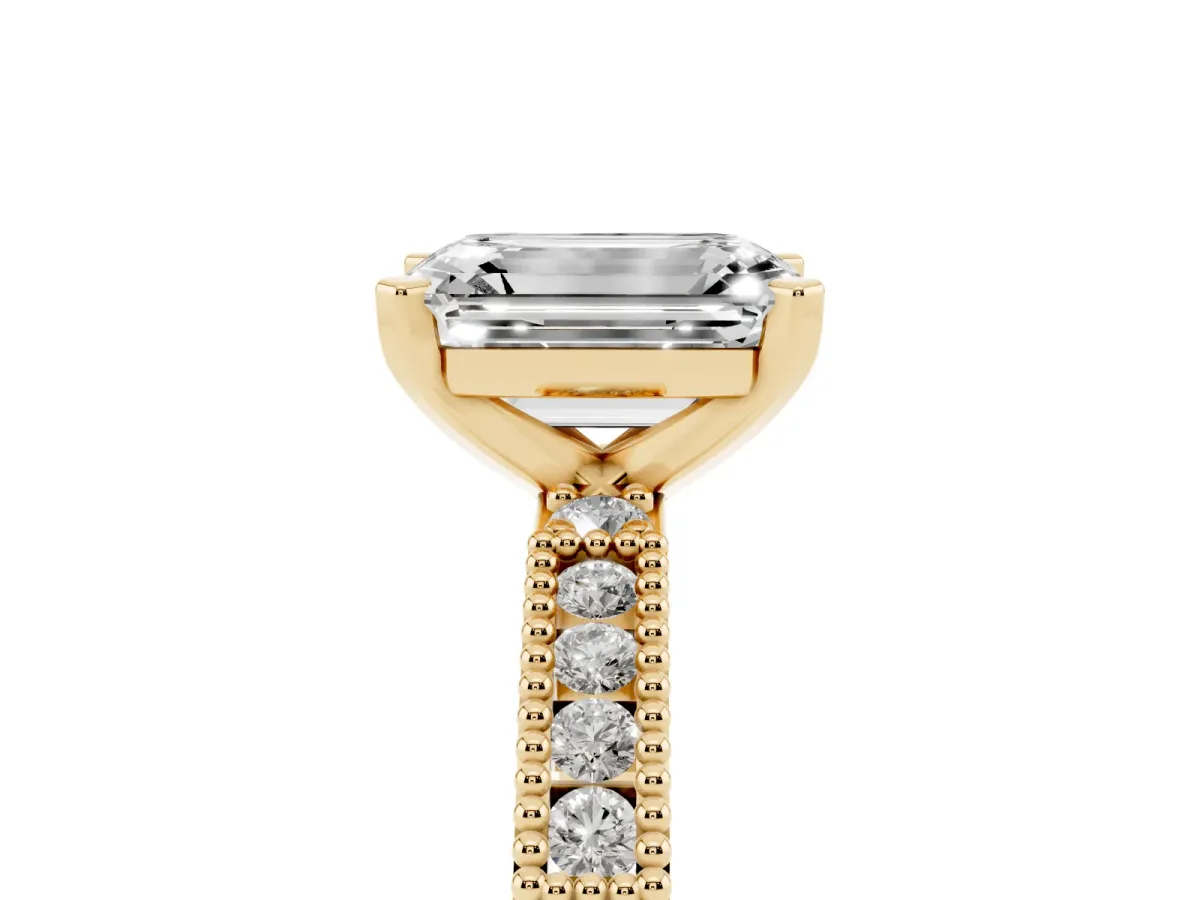 Emerald Cut Solitaire with Pavé Band and Four-Prong Setting Yellow gold