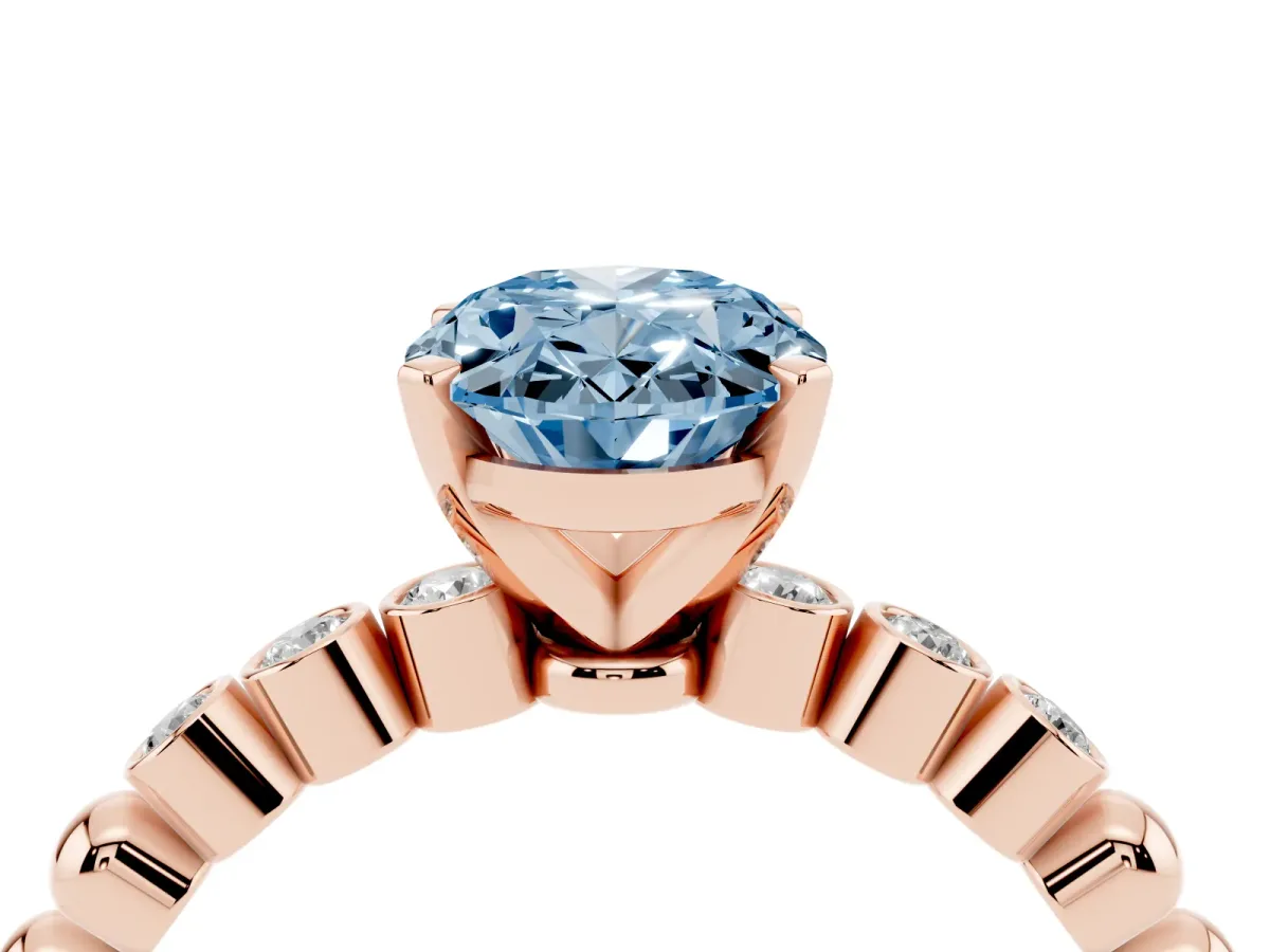 Fancy Blue Oval Cut Solitaire Bezel Accent Diamond Engagement Ring with Beaded Band and Four-Prong Setting Rose gold