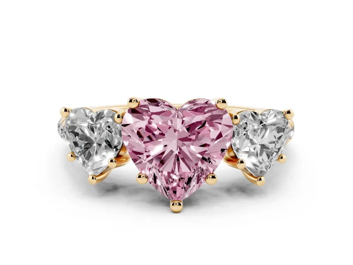 Fancy Pink Three-Stone Heart Cut Diamond Ring with Round Pavé Band and Prong Setting Yellow gold