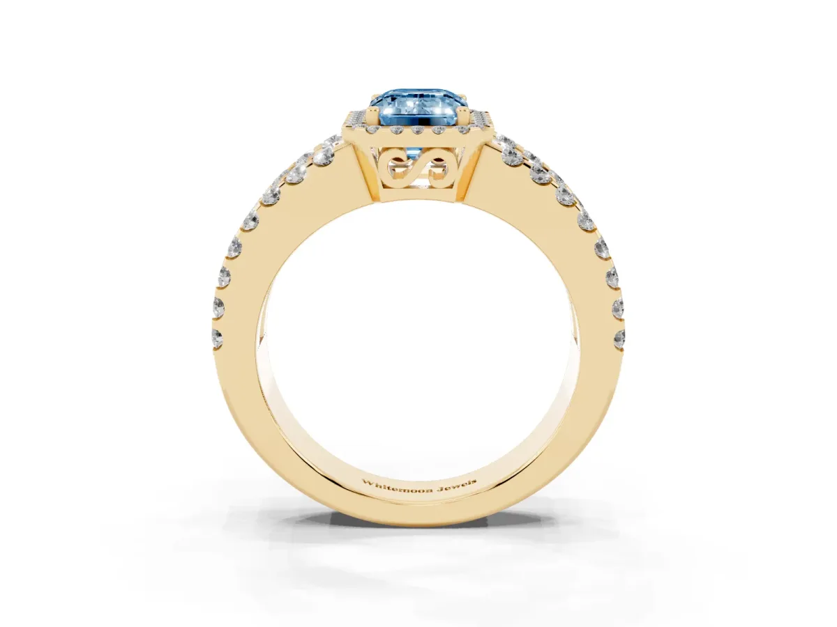 Fancy Blue Emerald Cut Cut Halo Split Shank Diamond Ring with Four-Prong Setting Yellow gold