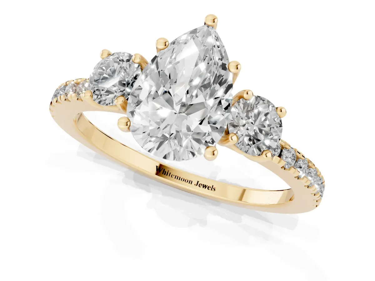 Three-Stone Pear Cut Cut Diamond Pavé Band with Prong Setting Yellow gold