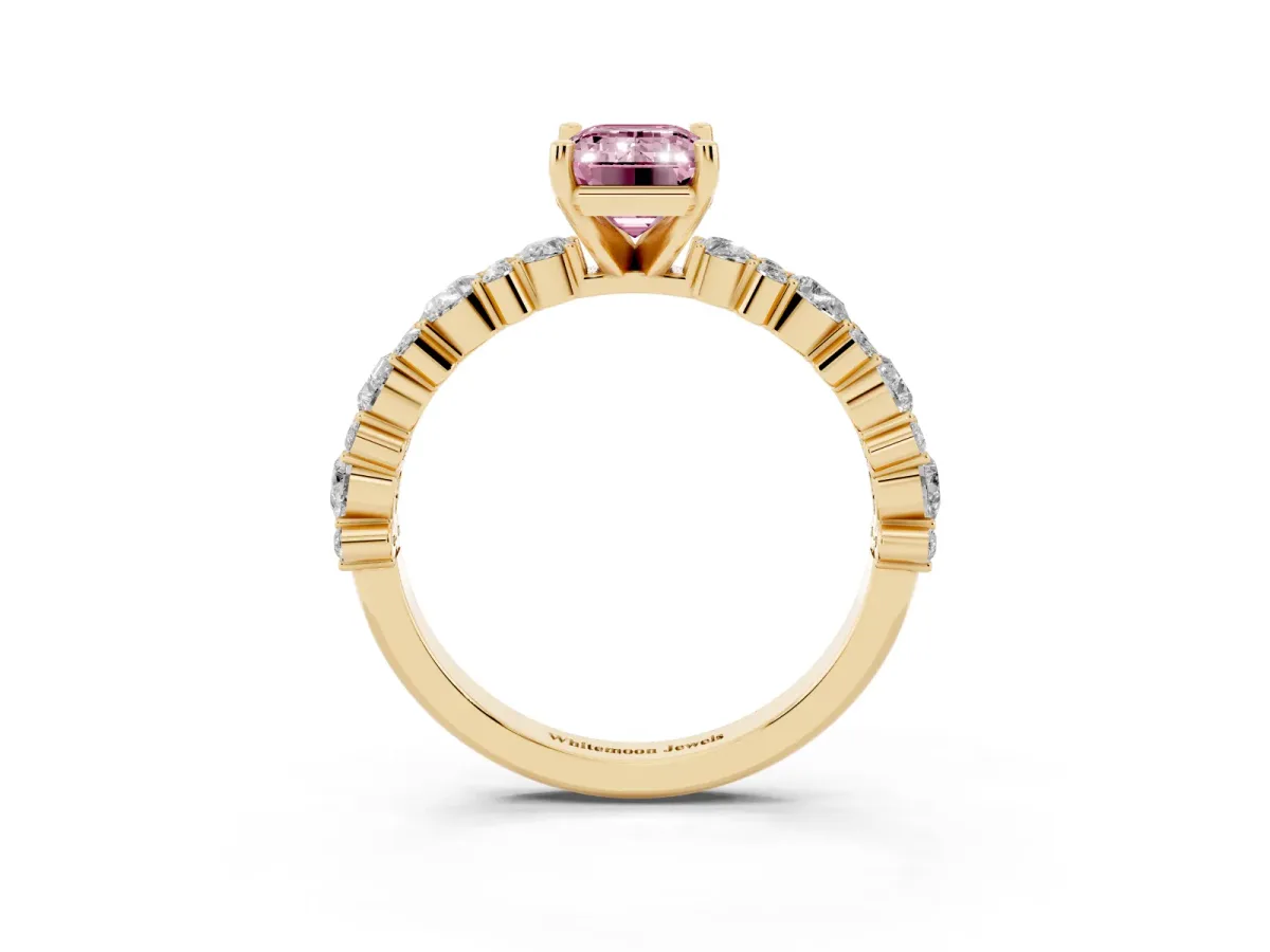 Fancy Pink Emerald Cut Diamond Side Stone Solitaire Ring with Round and Four-Prong Setting Yellow gold
