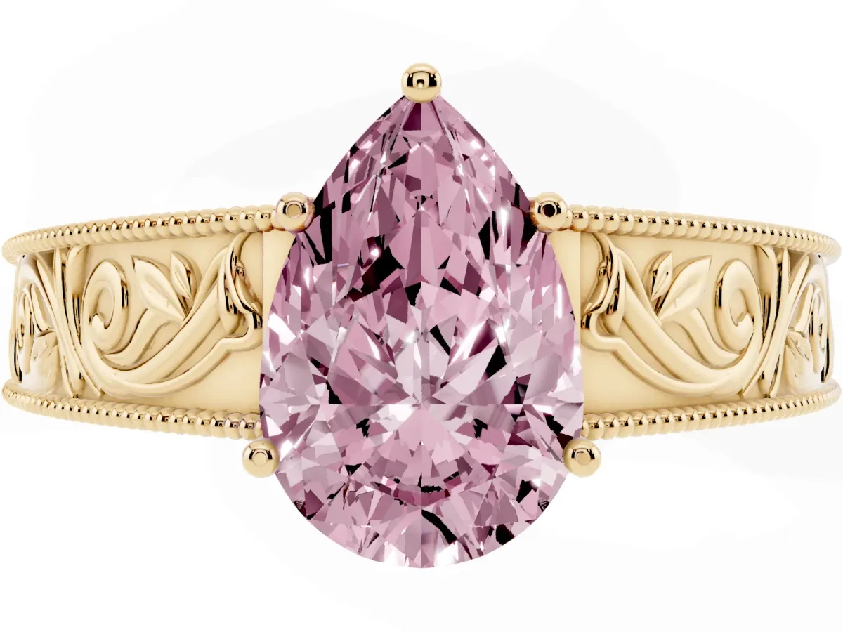 Fancy Pink Pear Cut Diamond Solitaire Ring with Engraved Band and Four-Prong Setting Yellow gold