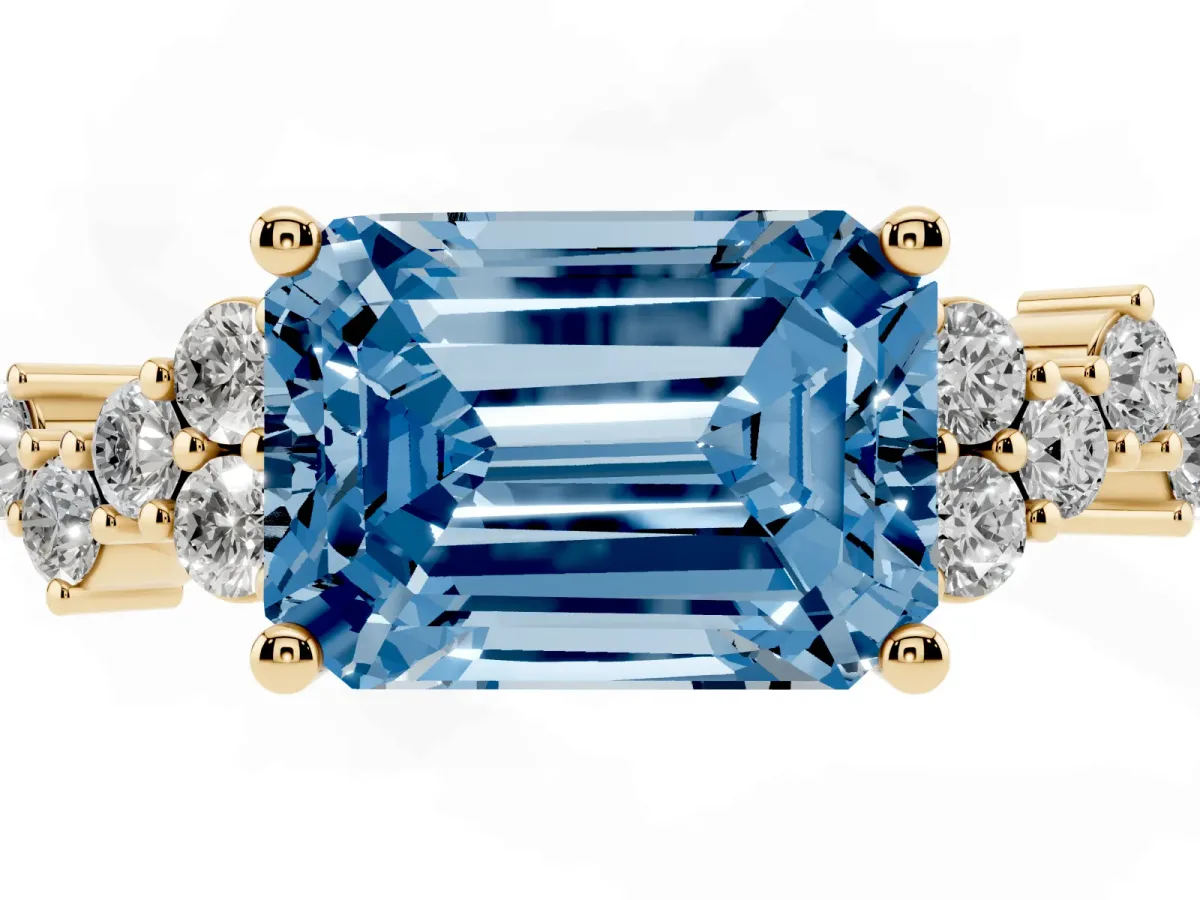 Fancy Blue Emerald Cut Diamond Scattered Round Accent Ring with Prong Setting Yellow gold