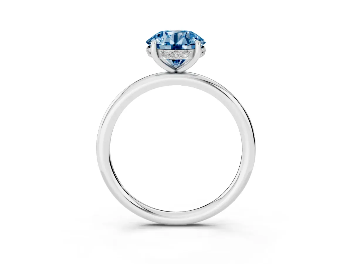 Fancy Blue Round Cut Solitaire Diamond Ring with a Classic Band and Four-Prong Setting Silver