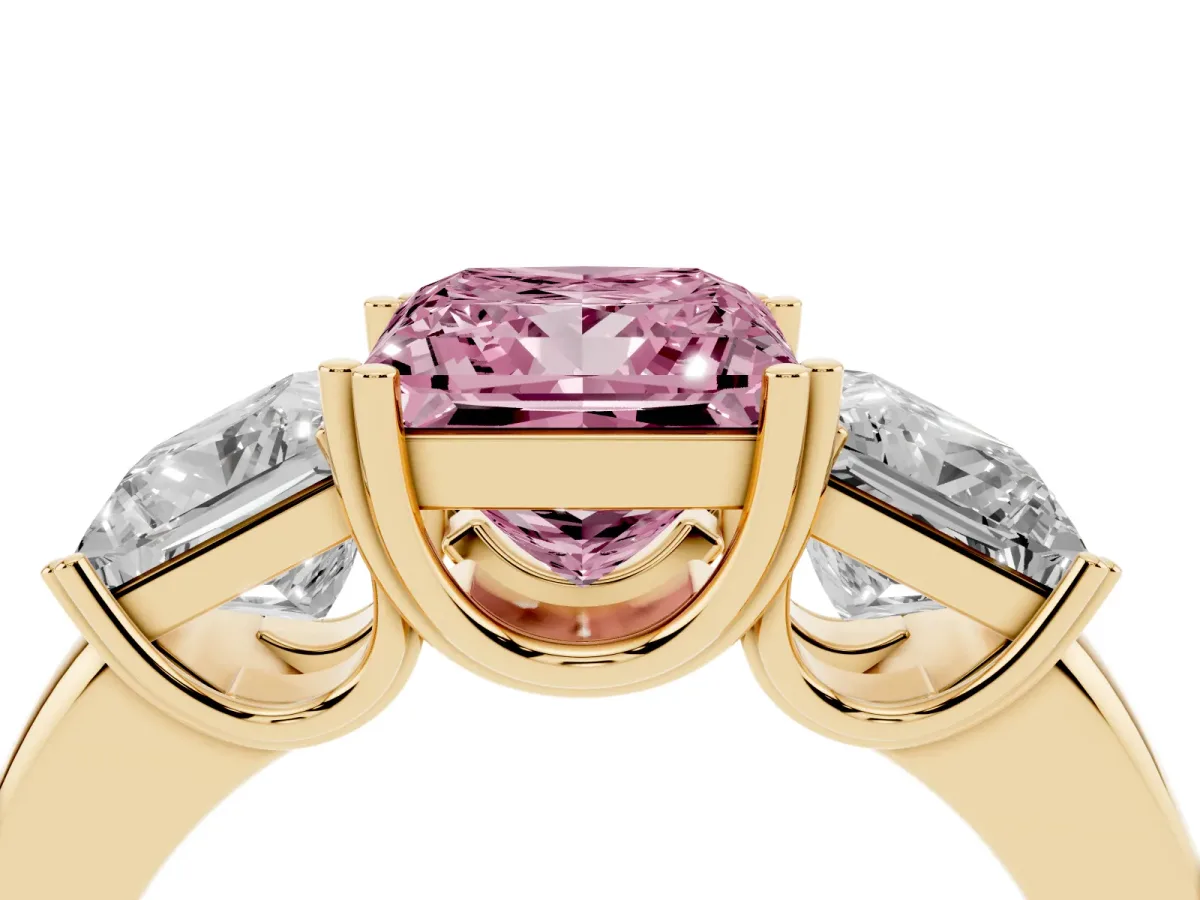 Fancy Pink Three-Stone Princess Cut Cut Diamond Ring with Channel Set Band and Four-Prong Setting Yellow gold
