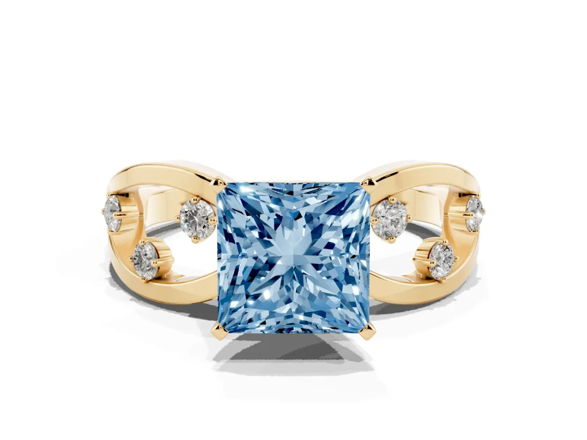 Fancy Blue Princess Cut Cut Solitaire Diamond with Side Stones on Criss-Cross Band and Four-Prong Setting Yellow gold