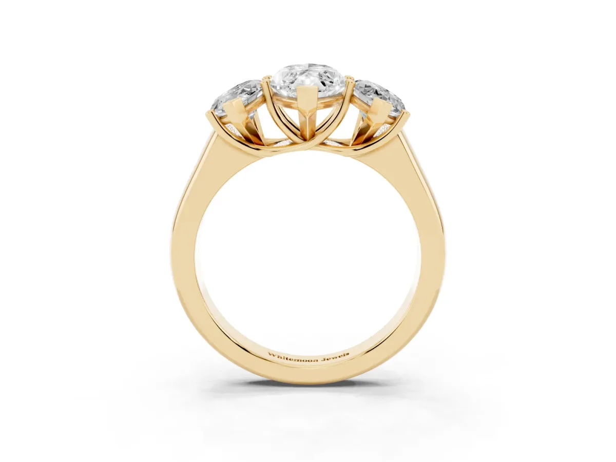 Marquise Cut Three-Stone Diamond Ring with Prong Setting on a Classic Band Yellow gold