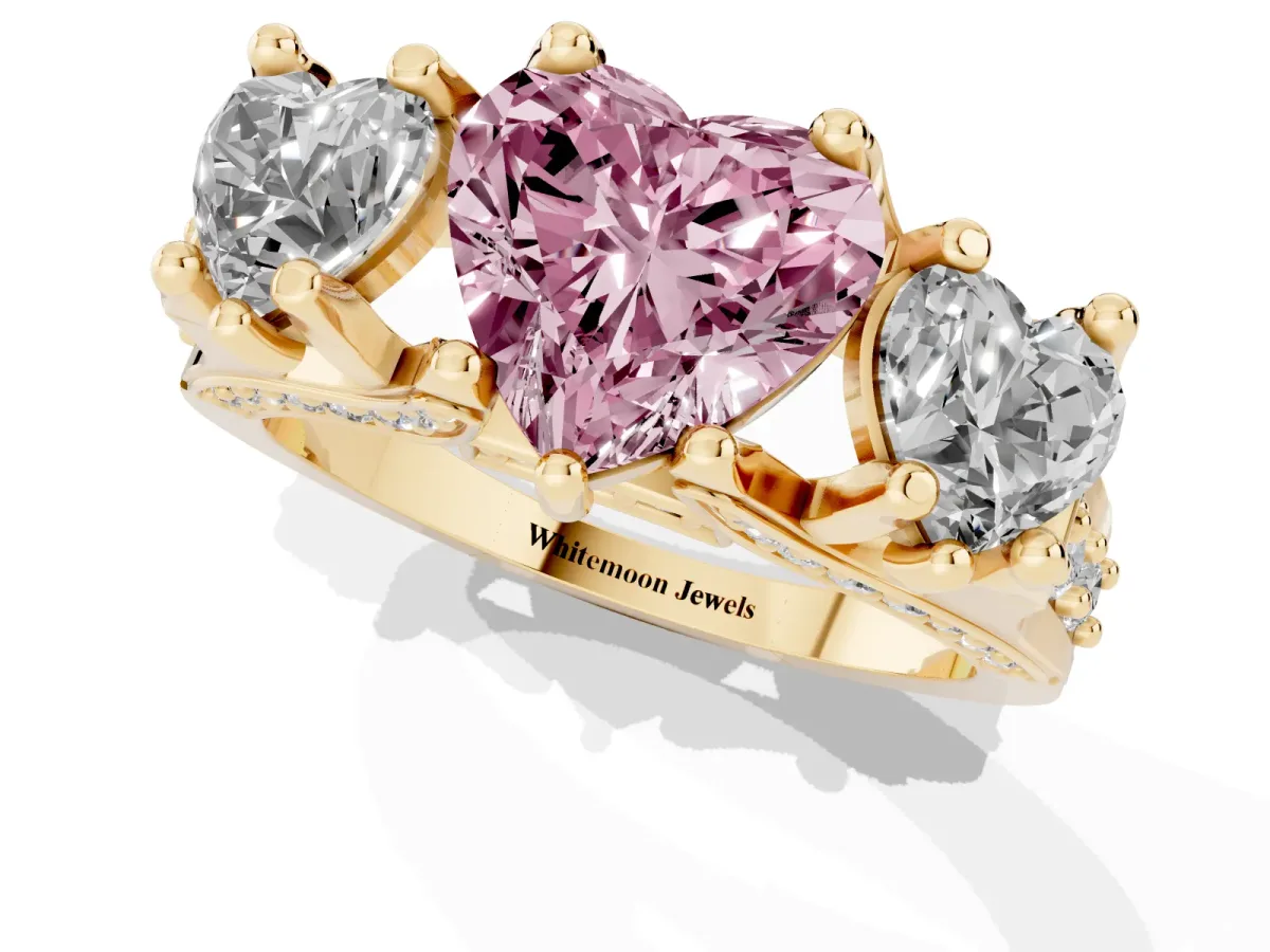 Fancy Pink Heart Cut Diamond Three-Stone Ring with Channel Set Band and Four-Prong Setting Yellow gold