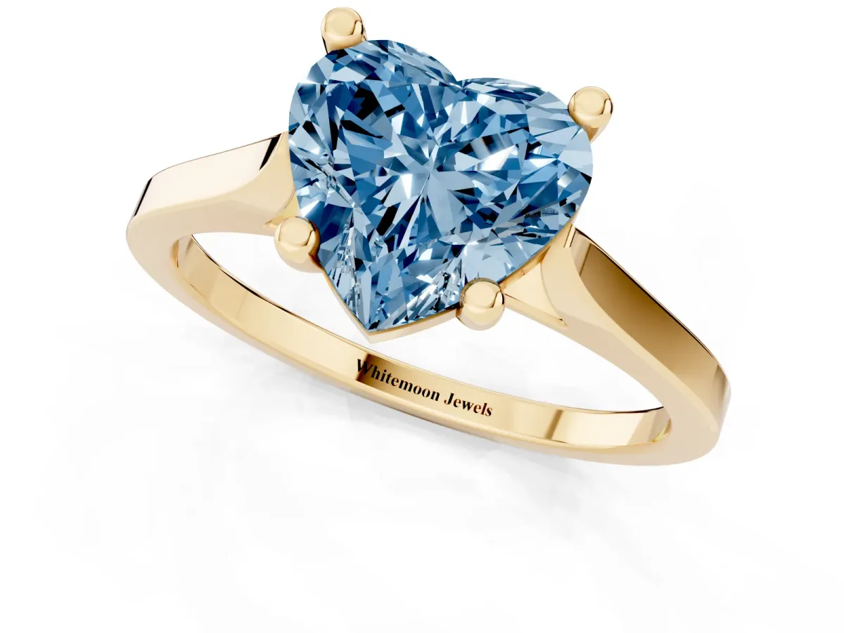 Fancy Blue Heart Cut Solitaire Diamond Ring with Four-Prong Setting and Tapered Band Yellow gold