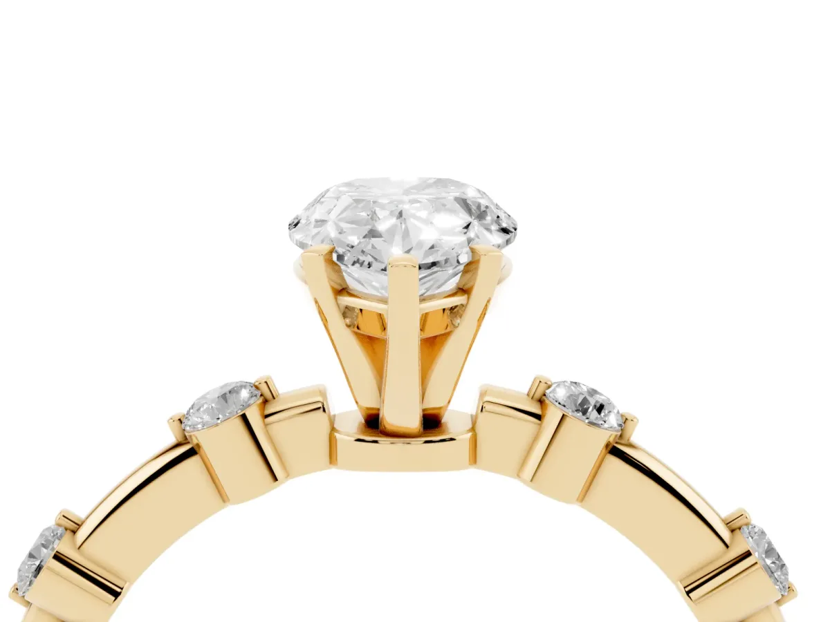 Pear Cut Solitaire Diamond Ring with Bezel Set Side Stones and Prong Setting Yellow gold
