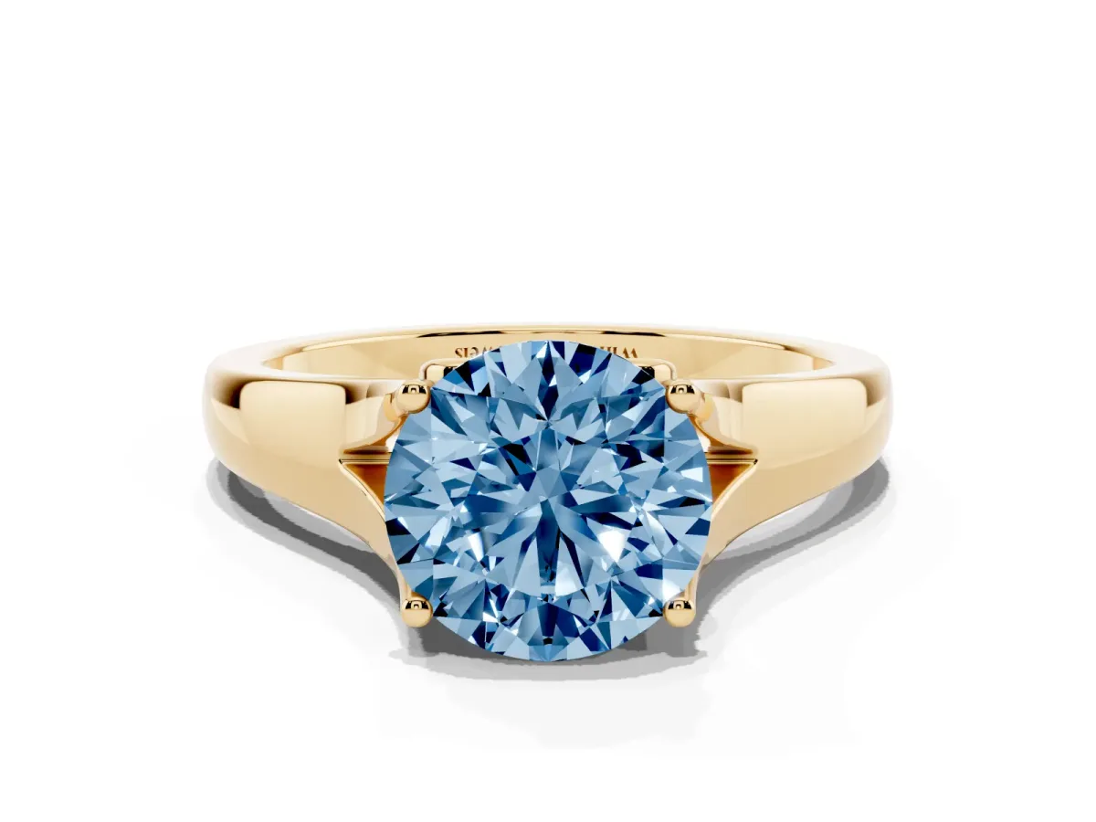 Fancy Blue Round Cut Solitaire Diamond Ring with Cathedral Band and Four-Prong Setting Yellow gold