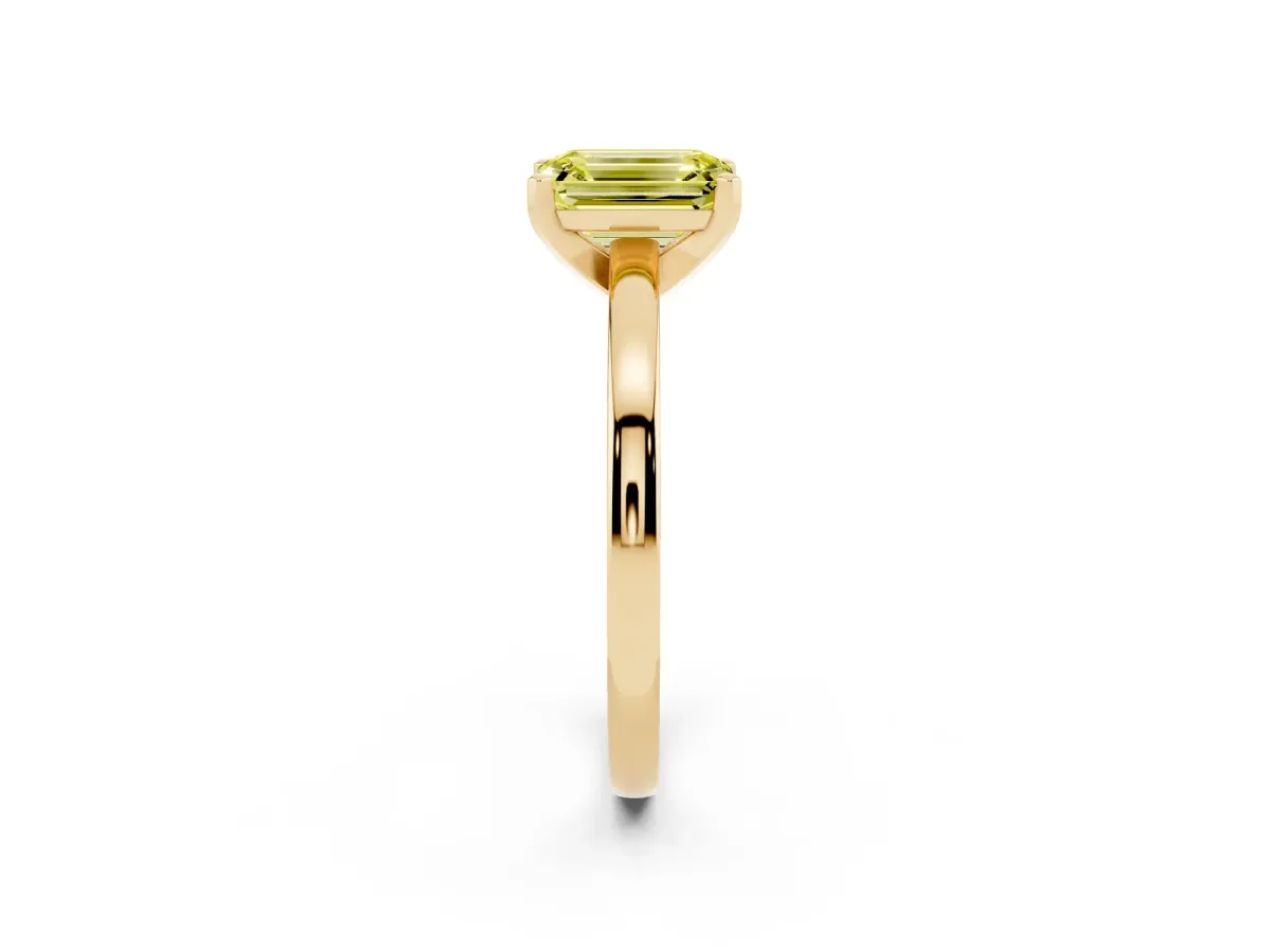 Fancy Yellow Emerald Cut Solitaire Diamond Engagement Ring with Four-Prong Setting on a Classic Band Yellow gold