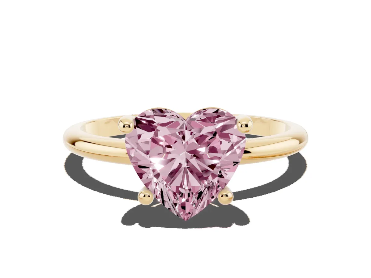 Fancy Pink Heart Cut Solitaire Diamond Ring with 4-Prong Setting on a Classic Band Yellow gold