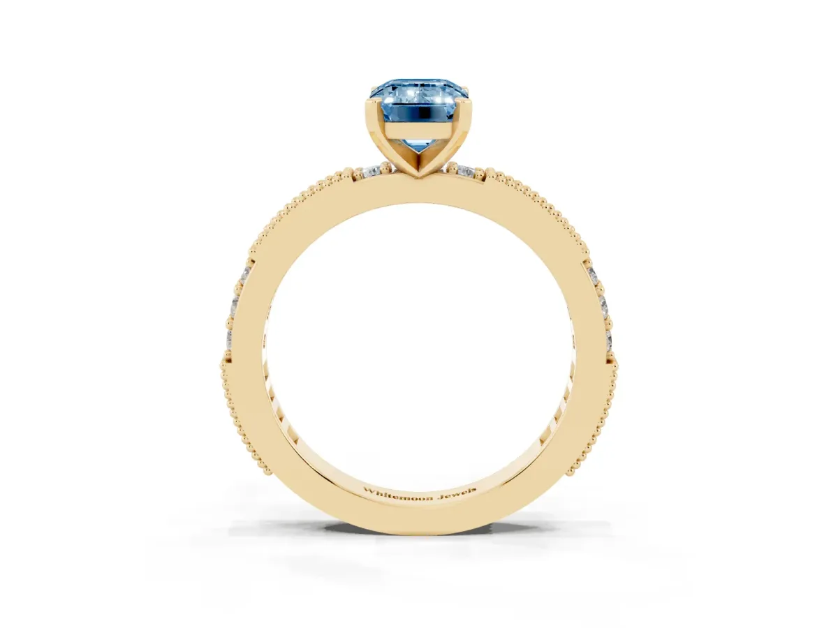 Fancy Blue Emerald Cut Solitaire with Pavé Band and Four-Prong Setting Yellow gold