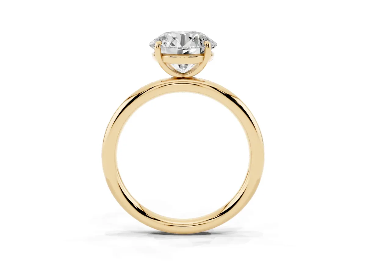 Round Cut Solitaire Diamond Ring with Four-Prong Setting on a Plain Band Yellow gold
