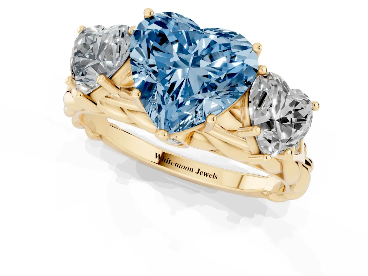 Fancy Blue Three-Stone Heart Cut Diamond Braided Band Ring with Four-Prong Setting Yellow gold
