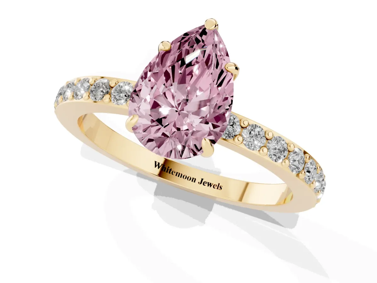 Fancy Pink Pear Cut Diamond Pavé Engagement Ring with Round Accents and Prong Setting Yellow gold
