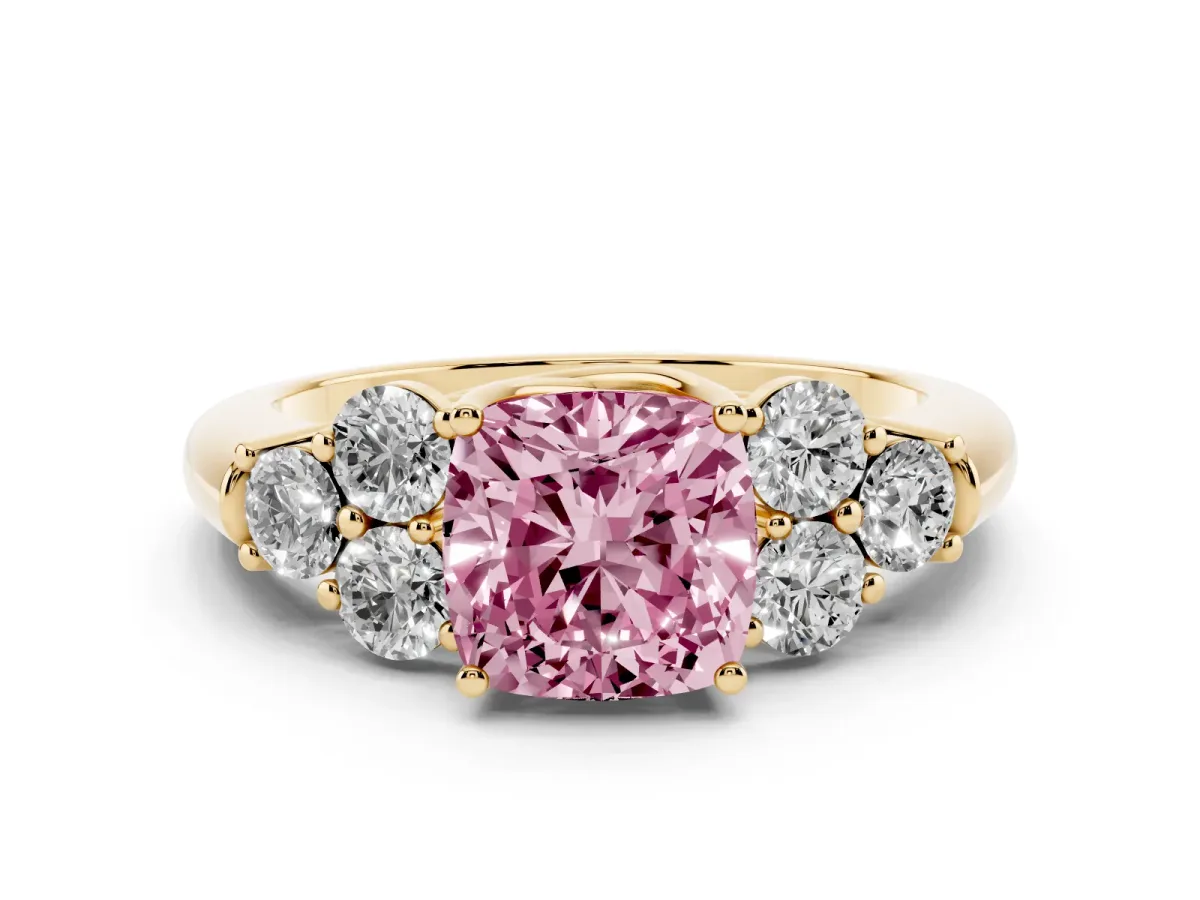Fancy Pink Cushion Cut Cut Diamond Cluster Ring with Round Accent Stones and Prong Setting on a Classic Band Yellow gold