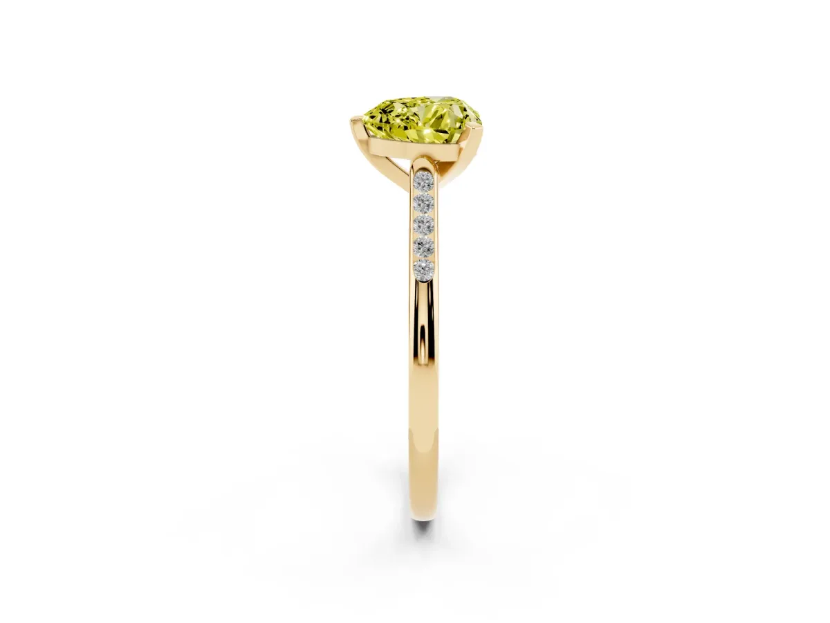 Fancy Yellow Heart Cut Diamond Solitaire Ring with Channel Set Round Band and Prong Setting Yellow gold