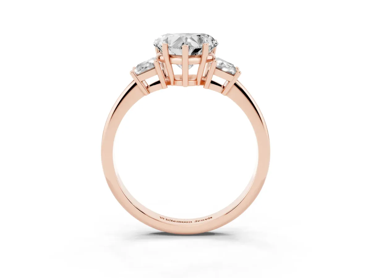 Heart Cut Diamond Three-Stone Ring with Trapezoid Side Stones and Prong Setting Rose gold