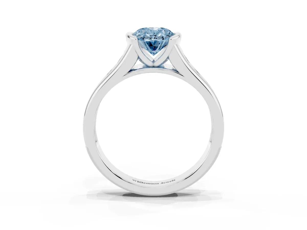 Fancy Blue Oval Cut Solitaire Bezel-Set Diamond Ring with Channel-Set Band Platinum