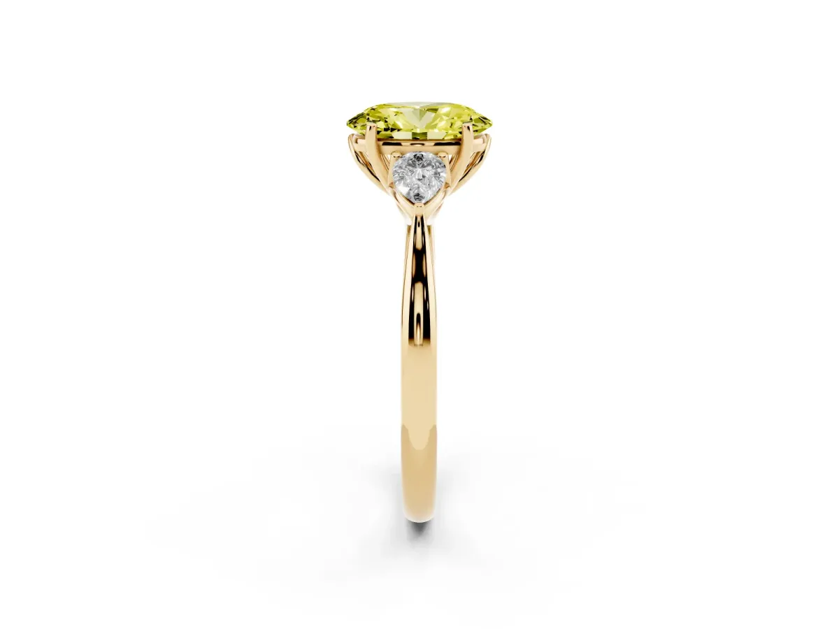 Fancy Yellow Three-Stone Oval Cut Brilliant Diamond Solitaire Ring with Tapered Band and Four-Prong Setting Yellow gold