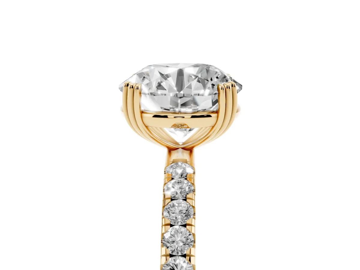 Round Cut Brilliant Solitaire with Pavé Band and Claw Prong Setting Yellow gold