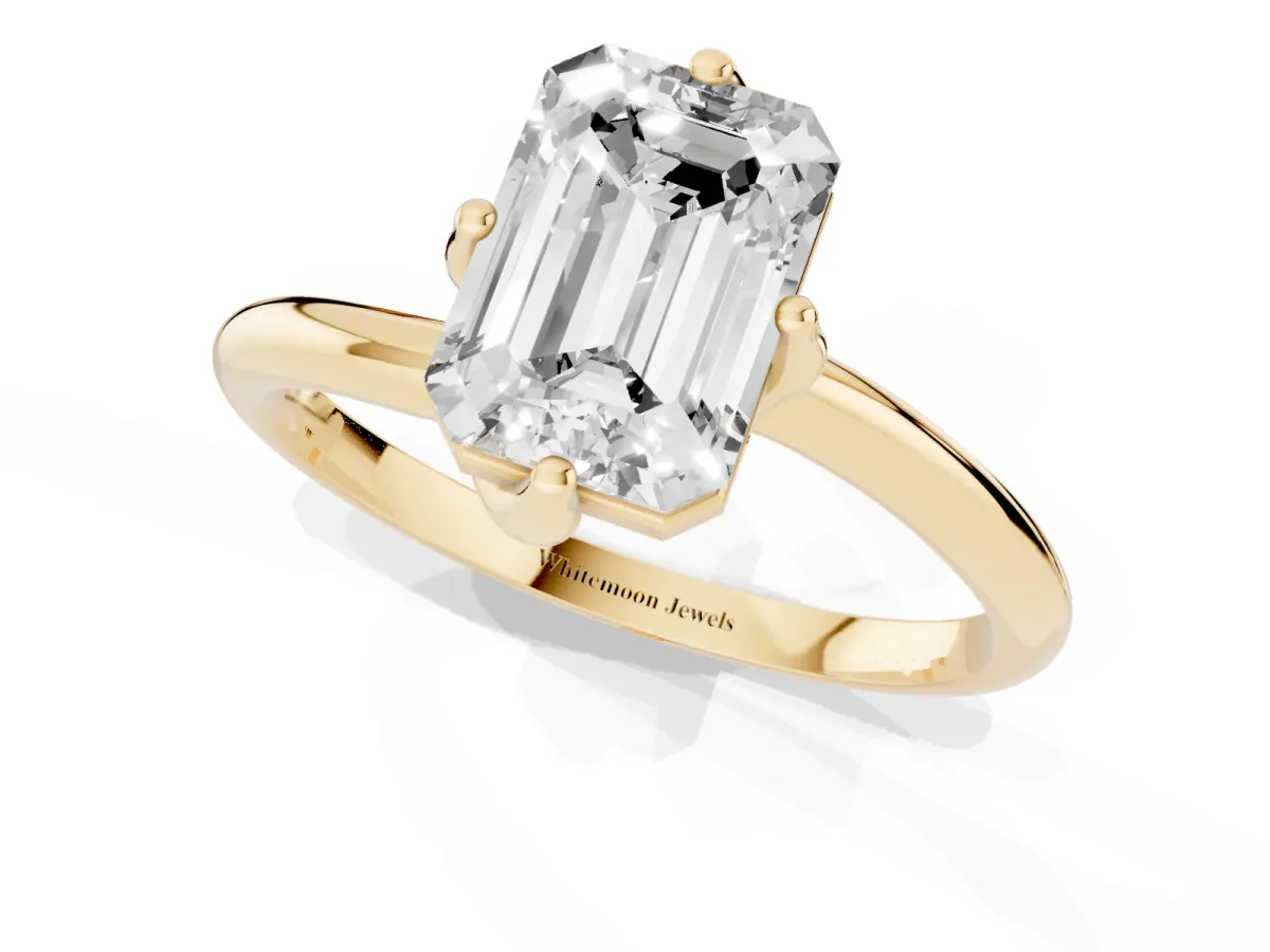 Emerald Cut Diamond Solitaire Engagement Ring with Four-Prong Setting and Classic Band Yellow gold