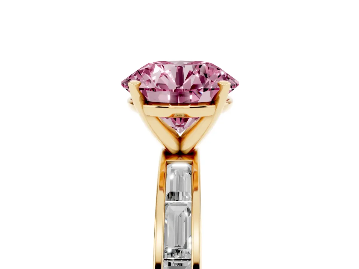 Fancy Pink Round Cut Solitaire Diamond Ring with Channel-Set Baguette Band and Four-Prong Setting Yellow gold