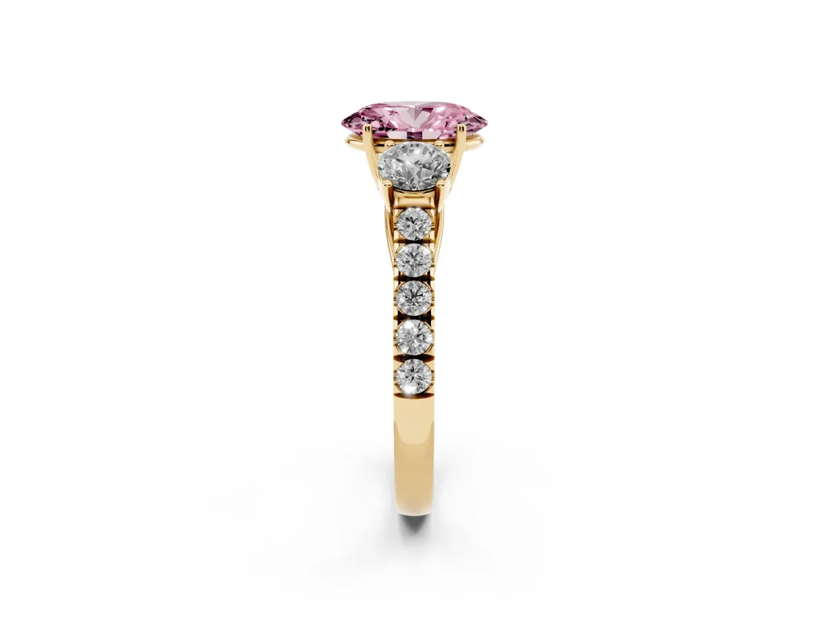Fancy Pink Oval Cut Cut Diamond Three-Stone Ring with Round Side Stones and Pavé Band Yellow gold